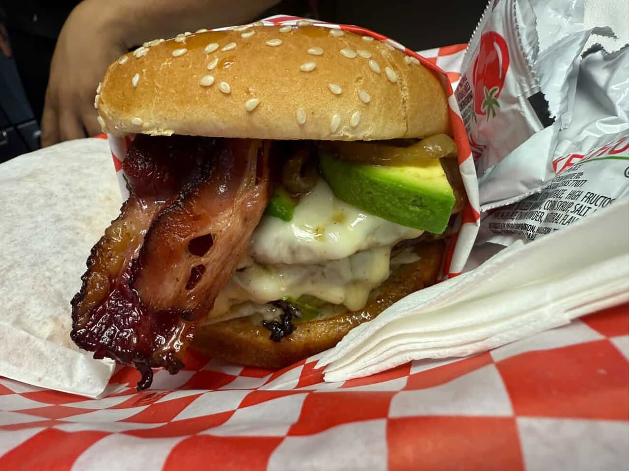 Avocado bacon burger with thick-cut beef bacon and fanned avocado slices